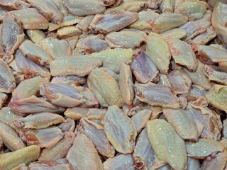 A close-up of raw chicken wings, ideal for food-related content and culinary projects. Fresh and ready for cooking or grilling. community mall September 10, 2024 Bangkok, Thailand.