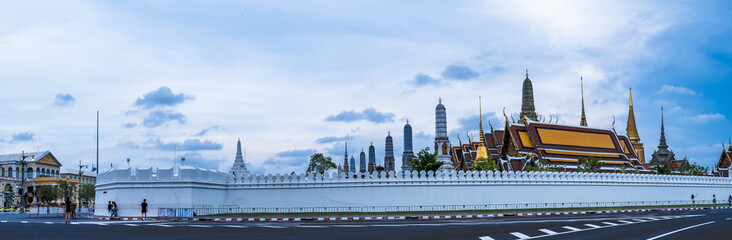 The panoramic view of the Grand Palace, also known as Wat Phra Kaew, was captured in Bangkok, Thailand, during the evening.