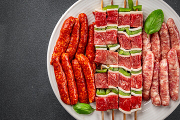 raw sausage meat assorted juicy pork, beef fresh gourmet food background on the table rustick food...