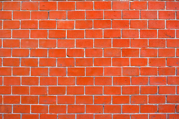 Fototapeta premium Red brick wall background. Old brickwork texture. Rock block pattern. Vintage stonewall. Abstract grunge urban design. Building masonry backdrop.