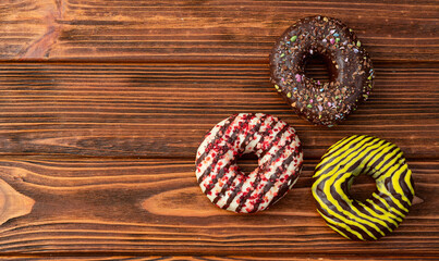 Sweet glazed colorful donuts . Top view