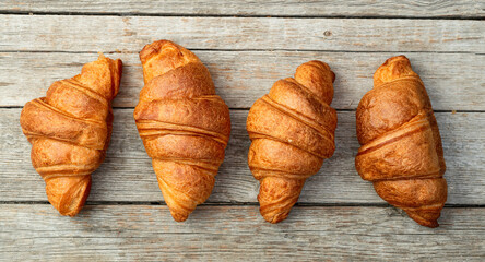 Group of sweet croissant . French morning breakfast . Top view