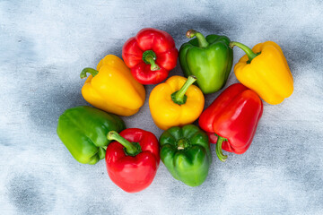 Fresh sweet bell pepper ( paprika ) photography red , green and yellow . Colorful vegetable . Top view