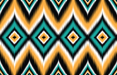 Teal and orange ikat pattern. Chevron geometric seamless design. Ethnic tribal motif. Vibrant bohemian textile print. Abstract wallpaper background. Modern trendy fashion fabric. Ikat repeat texture.