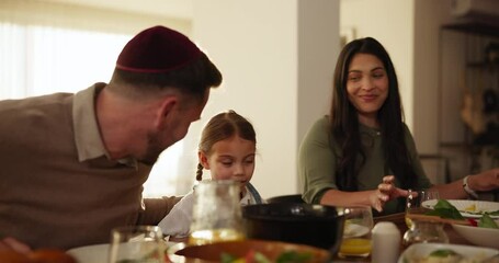 Eating, food and child with parents at dinner, celebration or together for Jewish event and meal. Girl, mom and dad talking in dining room with happiness on holiday for New Year party in home