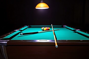 A pool table lit by a single overhead lamp, casting long shadows and creating a moody, dramatic effect