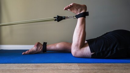 Exercise with espadrilles. Exercise for the biceps femoris