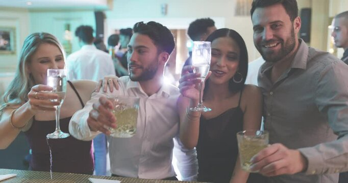 Toast, drinks and party with friends at nightclub for music, relax and celebration. Happy hour, cocktails and social event with portrait of group of people for cheers, new years and alcohol together
