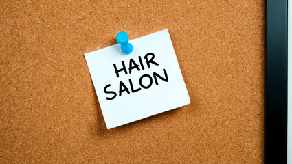 Hair salon word written on a note sticky on corkboard