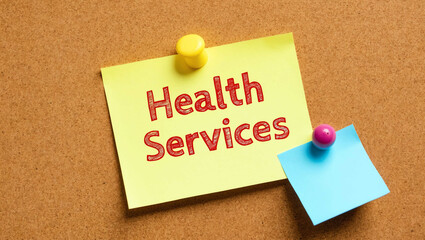 Health Services word written on a note sticky on corkboard
