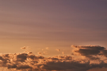 Serene Sunset Sky with Soft Clouds