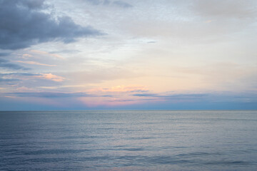 Obraz premium Beautiful tropical beach with sunset sky in the evening. Sea space area. Natural landscape