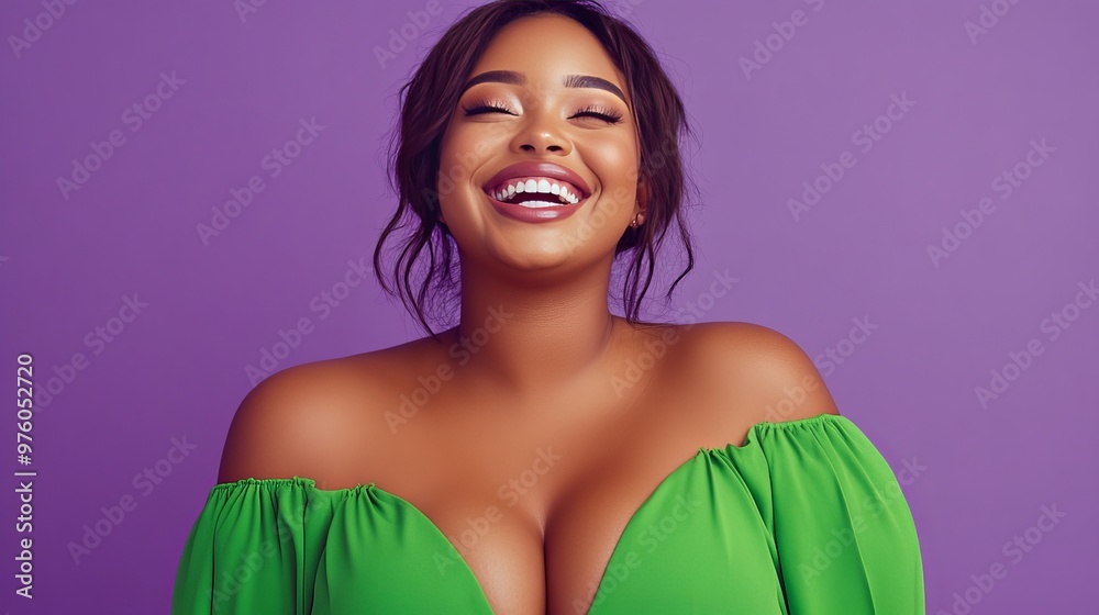 Wall mural Portrait of a beautiful black woman with curly hair smiling against a purple background wearing a green off-the-shoulder top.