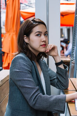 Freelancer looking at camera with pen in hand