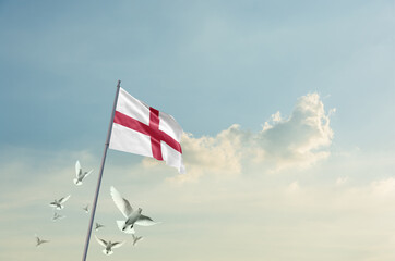 England flag waving with flying doves in beautiful sky. England flag for Republic Day and Independence Day.