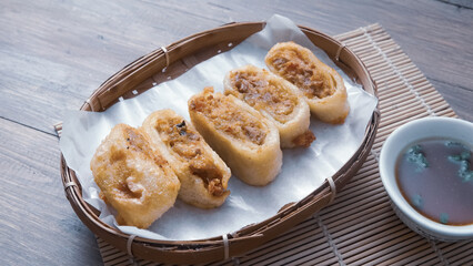Gohyong is typical chinesse food served with sliced ​​chilies and cuko sauce.