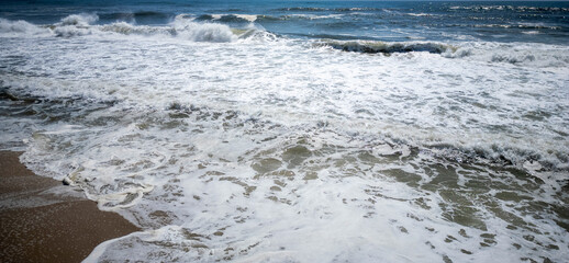 Large waves crashing down on the shores of Fire Island New York