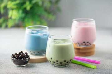 Different Healthy vegan drink Matcha  Latte  with Boba or Tapioca pearls in glasses. Bubble tea concept
