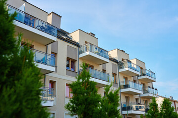 Residential building facade with balconies and windows. Modern city architecture. Apartment building exterior