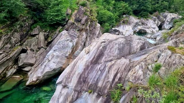 Switzerland Ticino Valle Verzasca Aerial 4K Video Scenic Emerald River with Granite Rocks and Waterfalls Alpine Nature Landscape of Swiss Alps Canton Ticino Famous Lavertezzo Travel Destination