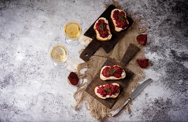 Beet ricotta bruschetta in a plate