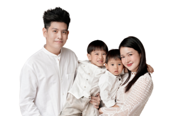 Happy Asian family portrait with mother, father, and two young children dressed in white, smiling warmly at the camera, isolated background. transparent PNG white background.