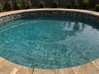 Hot tub in the middle of a pool.