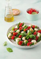 A plate with Italian salad caprese canape