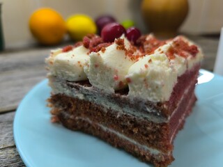 delicious piece of cherry cake covered with icing and cherries. High quality photos