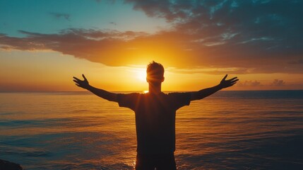 Fototapeta premium Silhouette of a Man Welcoming the Sunrise