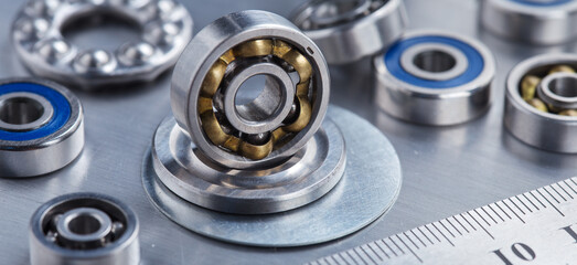 Obraz premium different bearings on a metal background. Part of mechanism.