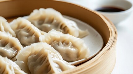 A beautifully arranged plate of traditional dumplings, with a soft focus and light solid color background, celebrating the festive season