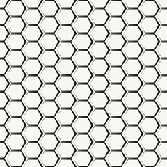 Obraz premium A pattern of interconnected hexagons creating a geometric design.