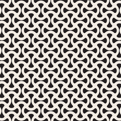 A repeating abstract pattern in black and white with organic shapes.