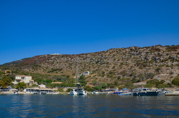 Zakynthos August 2024, amazing multicolored and surprising landscapes and a floating ship on the sea