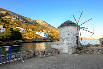 Small windmill in the port of Aegiali on Amorgos island. Cyclades, Greece