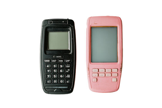 Two old mobile phones, one black and one pink, isolated on a white background. PNG transparent.