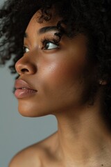 Fototapeta premium Close-up portrait of a woman with black hair and undefined facial expression