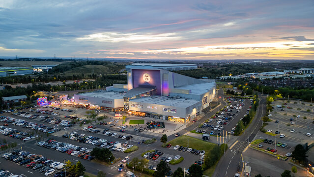 Castleford, West Yorkshire, United Kingdom - September 15 2024: Xscape entertainment center and sunset at the background. 