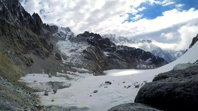 Panoramic view from Cho La (or Chola) mountain pass in Himalayas on snowy valley with footpath towards Everest base camp. Lobuche mountain peak in the background. Time lapse video. Landscapes theme.