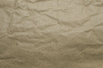 Recycled brown paper, with wrinkled and crumpled texture, with creases, and volumetric shadows
