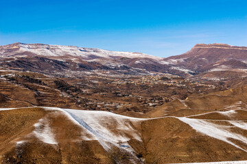 On a plateau surrounded by mountains lies a village of Dagestani highlanders