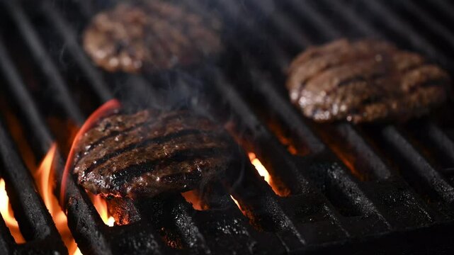 Delicious and mouth-watering cutlets with a grill pattern. The burgers are browning and sizzling, creating a mouth-watering aroma.