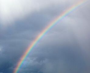 rainbow arch in the sky after the storm and it is a sign of good luck and good fortune