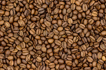 roasted coffee beans as background and texture taken in close-up