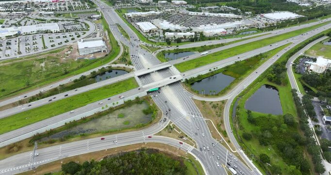 Freeway diverging diamond junction with fast moving traffic cars in Sarasota, Florida. Interstate transportation infrastructure in USA.
