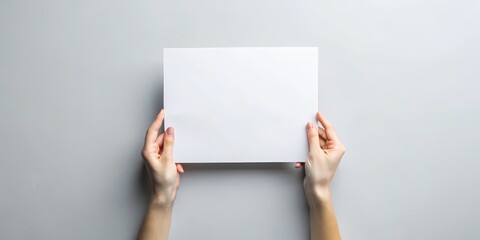 Fototapeta premium Hands Holding Blank White Paper, Mockup, Design, Template, Paper, Blank, White