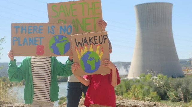 Families protesting for renewable energy and environmental protection in front of nuclear power plant