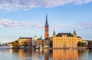 Stockholm, Sweden - 1 October 2022: Gamla Stan, old town in Stockholm at sunset with Riddarholmskyrkan church 