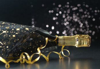 New Year concept, with bright light and champagne glass, abstract bokeh background